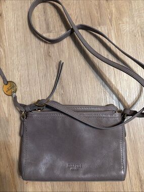 margot taupe leather crossbody with gold tag